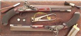 Pair Sturman (London) .60 caliber dueling pistols, engraved, cased, layaway