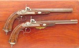 Game scene engraved pair of percussion target pistols, .495-inch bore diameter, high condition, cased, layaway - 2 of 13