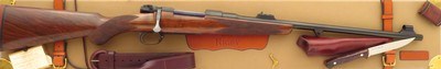 Rigby limited edition .275 Rigby, WDM Bell #16/50, Mauser 98, flat bolt handle, 3P, engraved, 8.0 pounds, 14-inch, serialed case, ammo, extras, 98% - Image 1 of 15