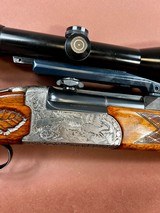 Superb engraved Antonio Zoli over/under combination gun with additional shotgun barrels and high end scope - 1 of 12