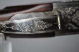 RUSSIAN - TOZ 34 EP - 12 GAUGE WITH EJECTORS - GAME SCENE HAND ENGRAVING
- 12 of 12