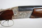 RUSSIAN - TOZ 34 EP - 12 GAUGE WITH EJECTORS - GAME SCENE HAND ENGRAVING
- 9 of 12