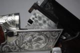 RUSSIAN - TOZ 34 EP - 12 GAUGE WITH EJECTORS - GAME SCENE HAND ENGRAVING
- 6 of 12