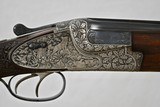 MERKEL 203E LUXUS - 20 GAUGE - DOUBLE TRIGGERS - DEEP GAME SCENE ENGRAVED WITH OAK LEAF CARVED STOCK - OAK AND LEATHER CASE - 1 of 19