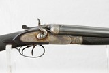 MANUFACTURE LIEGEOISE D'ARMAS - HAMMER SHOTGUN WITH STEEL BARRELS AND PIGEON STYLE RIB WITH GOLD LETTERING