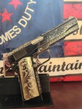 Colt custom, one of a kind, Govt 1911 .45acp 2 tone nickel fully engraved.
