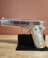 Colt .38 Super. Stunning fully engraved, 24k rose gold with nickel small parts and silver grips.