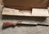 Savage 93R17 .17 HMR Rifle Hardwood - 1 of 4