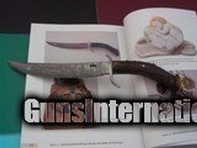 Chuck Patrick "Jethro" Damascus Bowie
Fighter Carved Mule Deer Crown handle with Ruby Eyes by Grussenmeyer 1996 Production