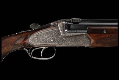 Factory Engraved Left Handed Johann Fanzoj Hand Detachable Sidelock Over/Under Combination 16ga/.222 Gun Two Barrel Set with Two Scopes - Image 1 of 5
