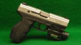 Taurus Model PT 24/7 9mm Pistol with Protec Light and Laser - 1 of 2