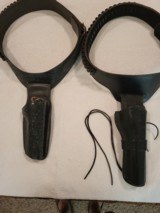 Two western leather gun belts and holsters--one 44/45 cal and one 357/38 cal
waist 30-32--nice shape - 1 of 9