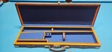 Good Quality, Highly Versatile Wood Bound Gun Case. Would accommodate Side by Sides, Over and Unders and Double Rifles