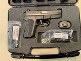 Sig Arms SP2340 pistol with Swiss-made Frame, Night Sights, two NEW barrels .357Sig .40S&W and 4 magazines plus NEW spare parts