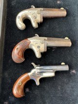 First, Second, Third Model Colt Derringers sold as a set of three. - 1 of 8