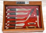 Early Buck knife display case with knives - 1 of 3