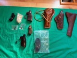 Smith and Wesson grips and leather holsters - 1 of 6