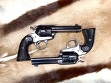 Colt Bisley a pair of 38WCF
4 3/4”. VG or better COND.