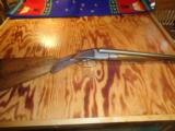 Baker's double barrel hammerless 12 gauge shotgun - 1 of 7