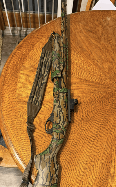 Remington 870 sps t green leaf shotgun.