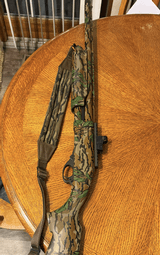 Remington 870 sps-t green leaf shotgun.