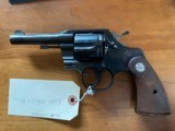 Colt Official Police Revolver with original grips in high condition.
