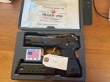 Ruger P89 with Factory case and accessories.