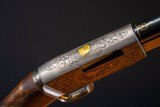 Browning pump action rifle in 22 long engraved by Master Engraver, Angelo Bee - 10 of 15