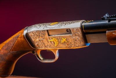 Browning pump-action rifle (Trombone) in 22 Long engraved by Master Engraver, Angelo Bee