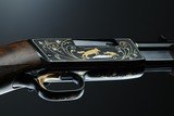 Browning pump action rifle (Trombone) in 22 Long engraved by Master Engraver, Angelo Bee