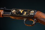 Browning pump action rifle (Trombone) in 22 Long engraved by Master Engraver, Angelo Bee