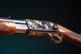 Browning pump action rifle (Trombone) in 22 Long engraved by Master Engraver, Angelo Bee - 8 of 15