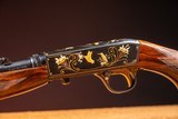 Browning semi-automatic rifle (Takedown) in 22 Long Rifle engraved by Master Engraver, Angelo Bee