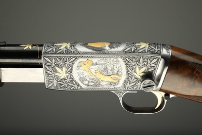 Browning pump action rifle (Trombone) in 22 Long engraved by Master Engraver, Angelo Bee