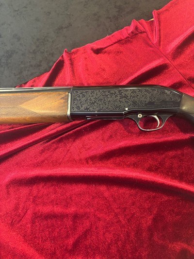 Engraved vintage Nikki 12 ga Shotgun