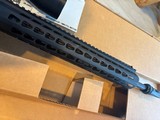 Beautiful unfired NIB custom Bushmaster with Bushnell tactical scope on Vortex Mt. Keymode fore end tactical flash-hider - Image 15 of 15