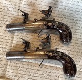 Pair of extra fine (circa 1810) English pocket pistols by Smith. w/silver wire inlay