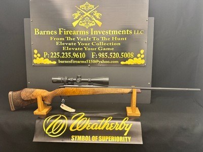 ***LIKE NEW*** WEATHERBY LH
MARK V 300 WBY MAG. CUSTOM ENGRAVED AAA WALNUT STOCK.