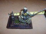 bergmann
cold
painted
bronze
arab
on
rug
w / rifle - 1 of 5