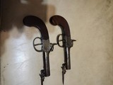pair ofsnapbayonetpistols.45 caliber - 1 of 6