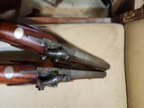 pair of
officers /
target
pistols
.51 bore - 10 of 11