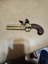 over and
under select
fire
all
brass pocket
pistol
.42
bore