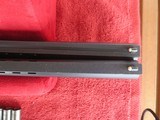 Beretta 682 sporting combo. 12ga. and 20ga. Briley ultra lights .410 and 28ga. J and S Air cushion stock. Multi chokes. - 8 of 12