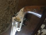 Smith & Wesson American 3 digit serial. Near mint.
- 2 of 4