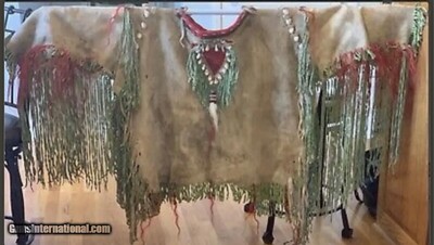 1800’s INDIAN BUFFALO HIDE ELK TOOTH SHIRT.
