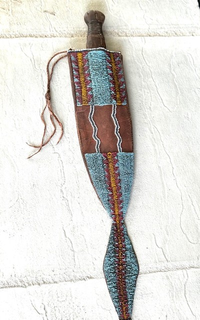 EXCEPTIONAL MID 1800 s BLACKFOOT DAG KNIFE & BEADED SHEATH.