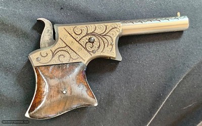 Factory Remington Engraved vest model.