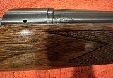 REMINGTON MODEL 7, IN THE RARE LIGHT RECOIL 7MM-08 CALIBER, PREMIUM WALNUT STOCK, 99+% CONDITION. - 13 of 15