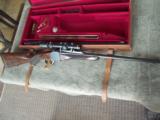 Westley Richards Take Down Two Barrel Set
Single 300 Holland Flanged and 400/360 Westley Nitro
Cased.
. - 11 of 15