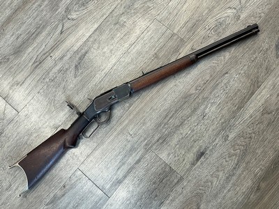 Winchester model 1873 in 32 cal. Lever action rifle with 21” octagon bbl, with special butt end